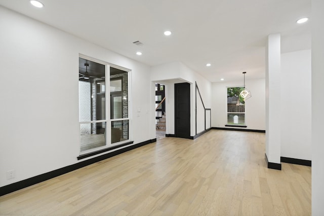 4219 Hollow Oak Dr, Dallas, TX 75287 - unfurnished room with light wood-style flooring, recessed lighting, baseboards, visible vents, and stairway