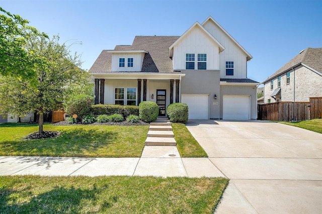view of front of property featuring a garage, a front lawn, fence, a shingled roof, and driveway