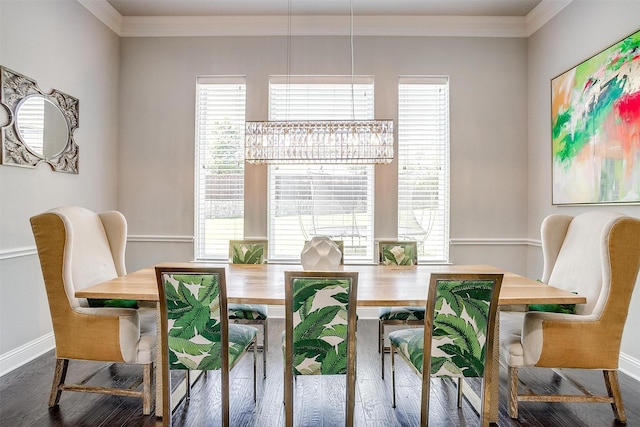 dining space featuring ornamental molding, wood finished floors, and a wealth of natural light