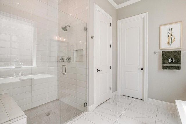 bathroom with baseboards, ornamental molding, a shower stall, and marble finish floor