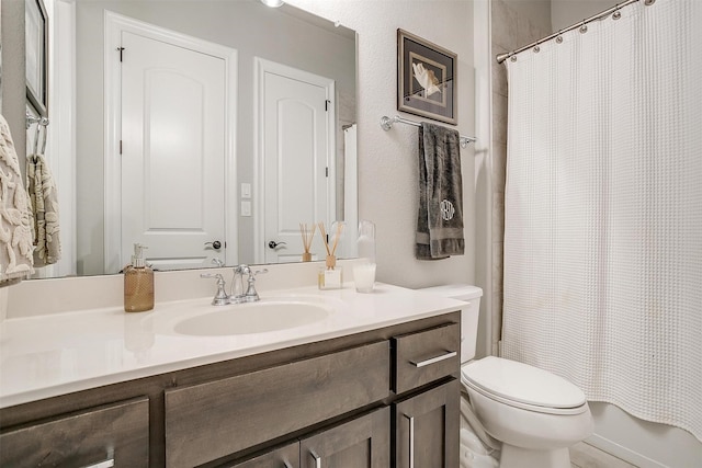 full bath with vanity, shower / bath combo with shower curtain, and toilet