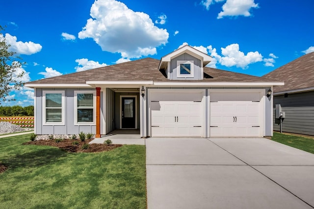 ranch-style house featuring concrete driveway, an attached garage, board and batten siding, and a front yard