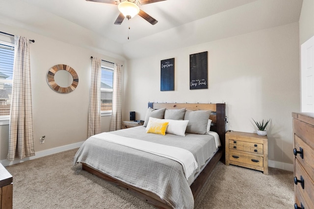 carpeted bedroom featuring baseboards and ceiling fan