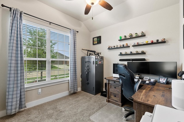 carpeted office featuring baseboards, ceiling fan, vaulted ceiling, and a wealth of natural light