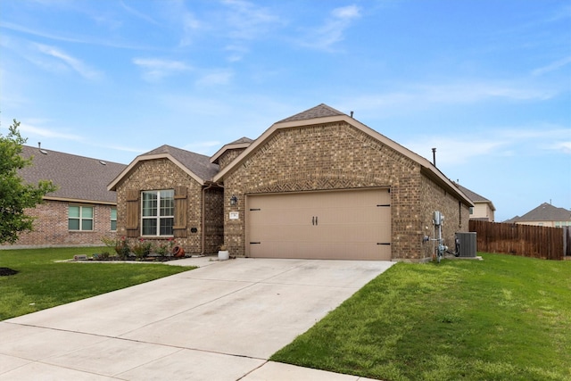 view of front facade with a garage, fence, concrete driveway, and brick siding