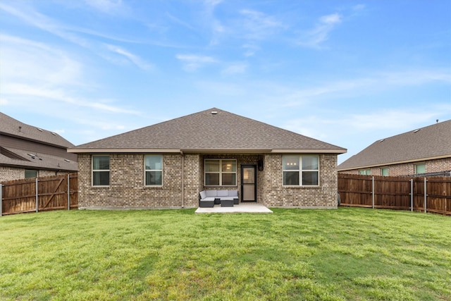rear view of house with brick siding, outdoor lounge area, a fenced backyard, and a patio area