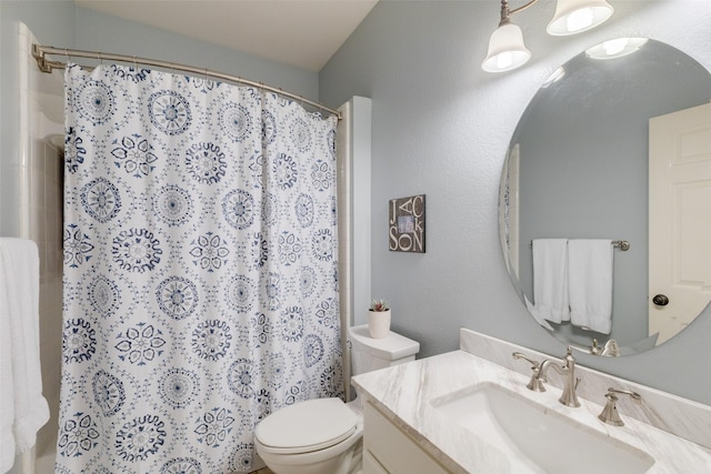 bathroom with vanity, toilet, and a shower with shower curtain
