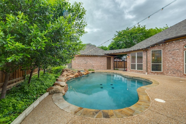 view of pool with a fenced in pool and a fenced backyard