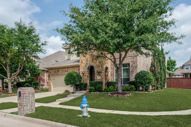 3504 Perkins Ln, Mckinney, TX 75072 - view of property hidden behind natural elements featuring fence, a front yard, brick siding, an attached garage, and driveway