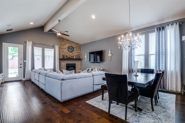 3504 Perkins Ln, Mckinney, TX 75072 - living area featuring ceiling fan with notable chandelier, vaulted ceiling with beams, dark wood-type flooring, and a wealth of natural light