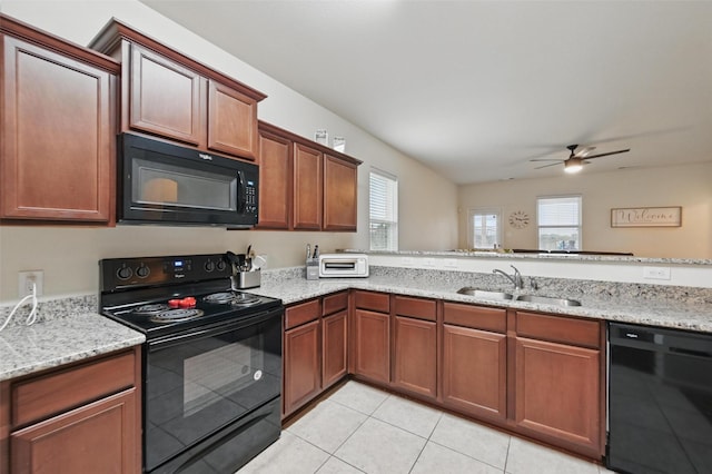 kitchen with black appliances, a sink, a ceiling fan, light tile patterned flooring, and light stone counters