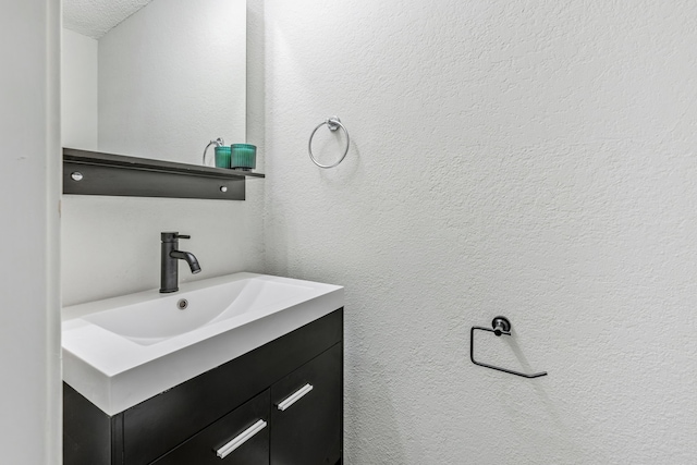 3801 14th St Unit 1607, Plano, TX 75074 - bathroom with vanity and a textured wall