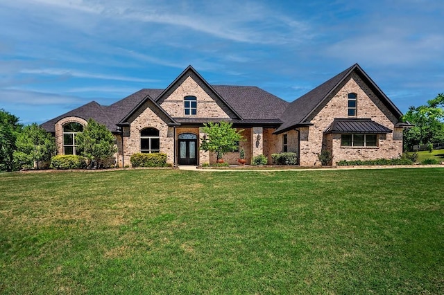 210 Tananger Springs Dr, Denison, TX 75021 - french provincial home with brick siding, french doors, and a front lawn