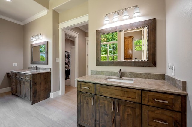 210 Tananger Springs Dr, Denison, TX 75021 - bathroom with crown molding, a sink, baseboards, and two vanities