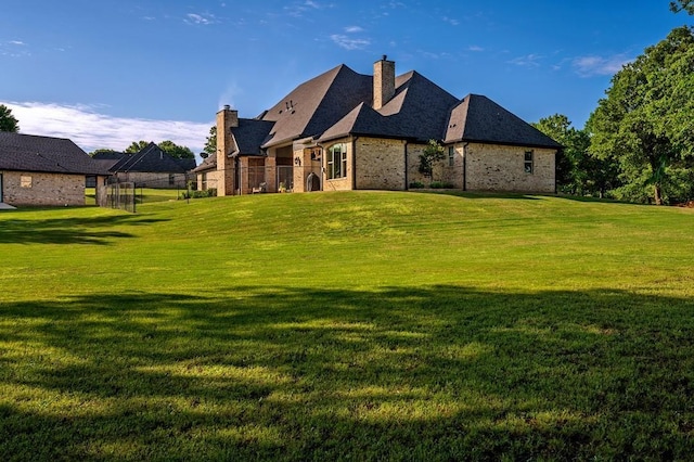 210 Tananger Springs Dr, Denison, TX 75021 - rear view of house with fence, a chimney, a yard, and brick siding