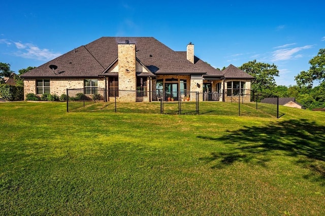 210 Tananger Springs Dr, Denison, TX 75021 - rear view of house featuring a lawn, brick siding, fence, and a chimney