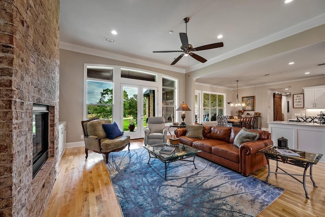 210 Tananger Springs Dr, Denison, TX 75021 - living area with a fireplace, recessed lighting, light wood-style flooring, and visible vents