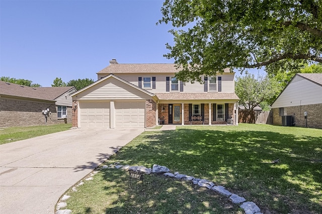 traditional-style home with a garage, a front yard, a chimney, a porch, and driveway