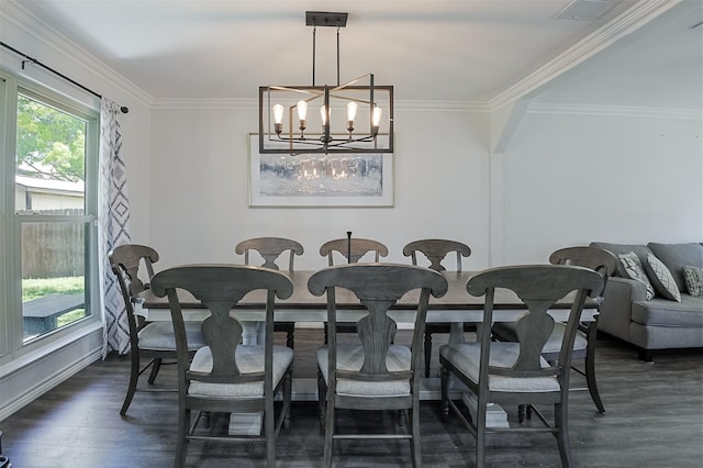 dining space with a chandelier, baseboards, dark wood-type flooring, visible vents, and ornamental molding