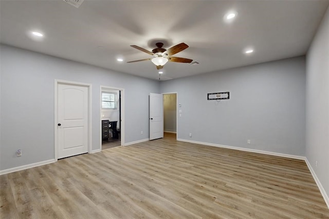 empty room with recessed lighting, ceiling fan, baseboards, and light wood finished floors