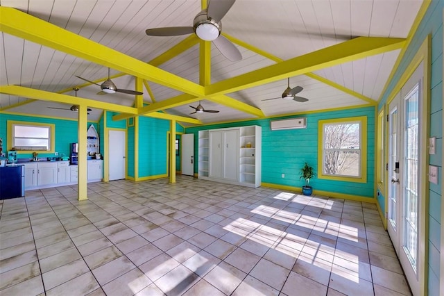 interior space with an AC wall unit, ceiling fan, lofted ceiling with beams, and wood ceiling