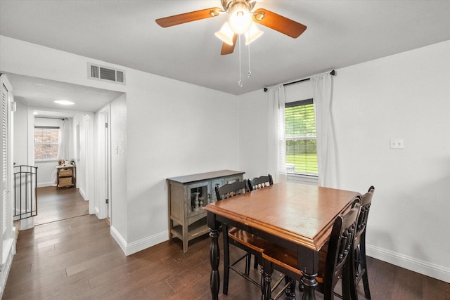 233 NE Moody St, Burleson, TX 76028 - dining space featuring a ceiling fan, baseboards, visible vents, and dark wood-type flooring