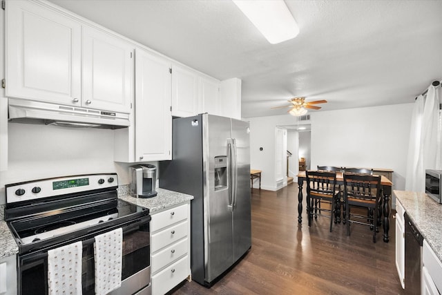 233 NE Moody St, Burleson, TX 76028 - kitchen with a ceiling fan, dark wood-style floors, under cabinet range hood, stainless steel appliances, and white cabinetry