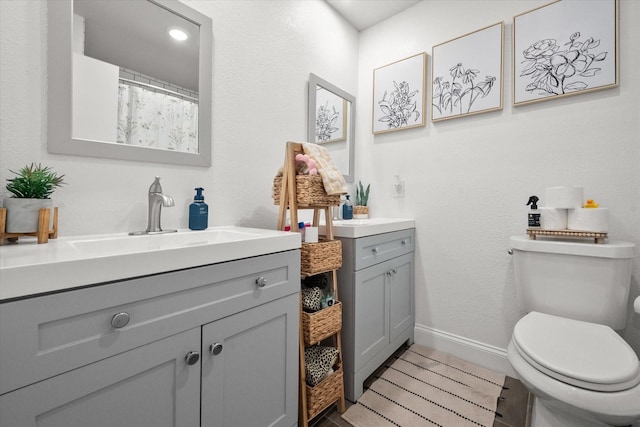 233 NE Moody St, Burleson, TX 76028 - full bath with vanity, baseboards, and toilet