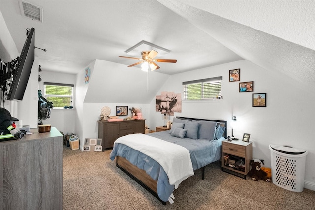 233 NE Moody St, Burleson, TX 76028 - bedroom with visible vents, carpet, vaulted ceiling, and multiple windows