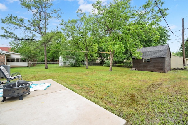 233 NE Moody St, Burleson, TX 76028 - view of yard featuring central AC, an outdoor structure, a shed, a fenced backyard, and a patio