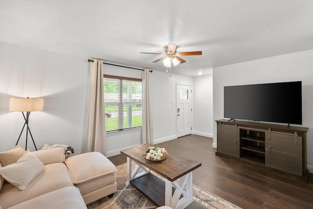 233 NE Moody St, Burleson, TX 76028 - living room featuring baseboards, ceiling fan, and dark wood finished floors