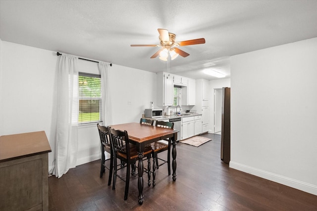 233 NE Moody St, Burleson, TX 76028 - dining room featuring baseboards, ceiling fan, and dark wood-style floors