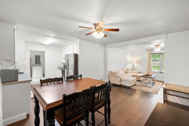 233 NE Moody St, Burleson, TX 76028 - dining space with washer / dryer, a ceiling fan, and dark wood-type flooring