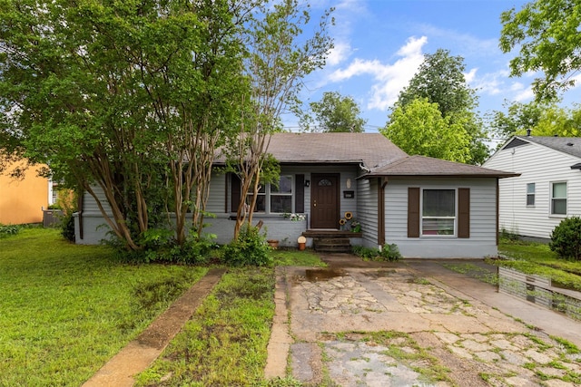 3724 Highgrove Dr, Dallas, TX 75220 - bungalow-style house with a shingled roof and a front lawn