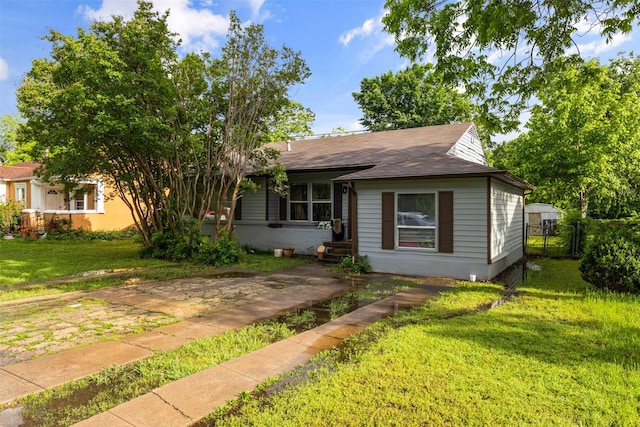 3724 Highgrove Dr, Dallas, TX 75220 - view of front of house with a shingled roof, fence, and a front yard