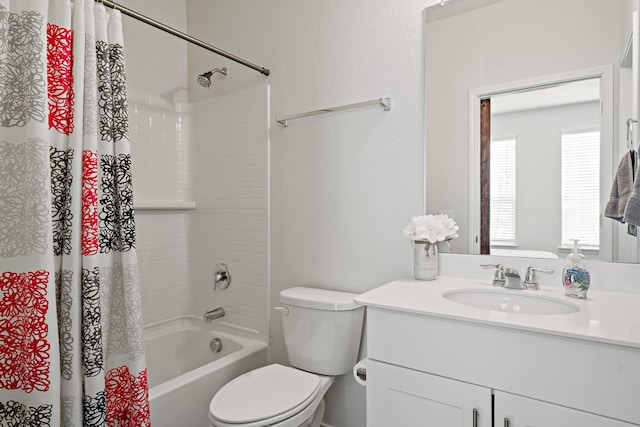 bathroom featuring vanity, shower / tub combo with curtain, and toilet