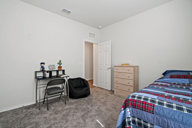 bedroom with visible vents and carpet
