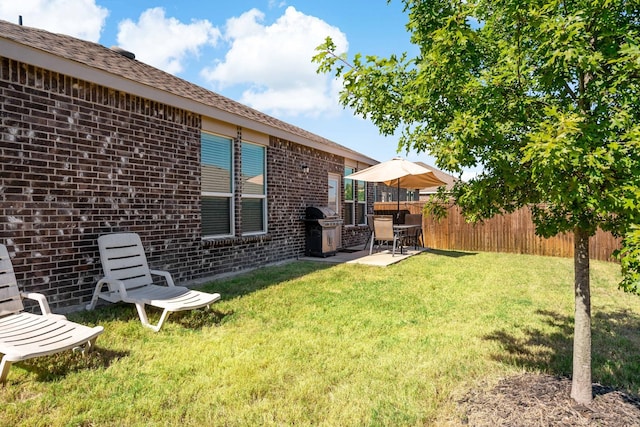 view of yard with a patio area and fence