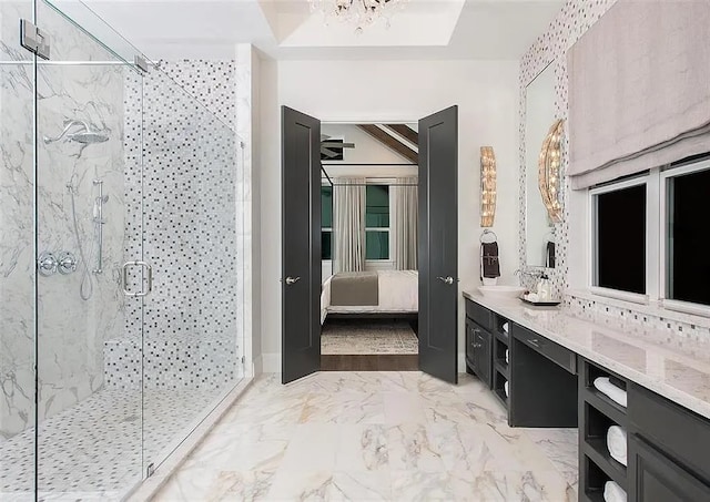 904 Devonshire Dr, Allen, TX 75013 - ensuite bathroom featuring a chandelier, connected bathroom, a shower stall, vanity, and marble finish floor