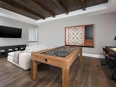 904 Devonshire Dr, Allen, TX 75013 - playroom with wood ceiling, baseboards, beamed ceiling, and wood finished floors