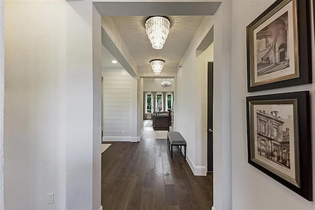 904 Devonshire Dr, Allen, TX 75013 - hallway with an inviting chandelier, baseboards, and dark wood-type flooring