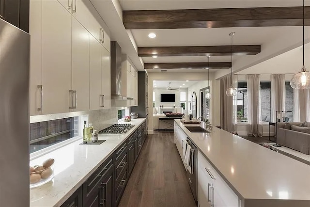 904 Devonshire Dr, Allen, TX 75013 - kitchen with open floor plan, dark wood-style flooring, appliances with stainless steel finishes, and wall chimney range hood