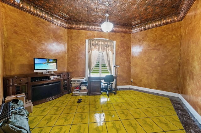 interior space featuring baseboards, ornamental molding, tile patterned flooring, and an ornate ceiling