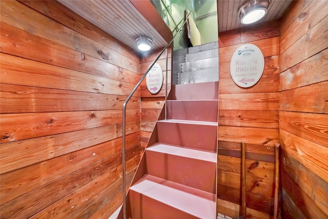 stairs with wood walls