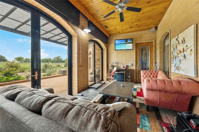 interior space featuring a ceiling fan, french doors, wood ceiling, and hardwood / wood-style floors