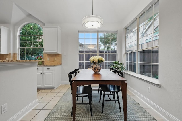 8926 White Pine Ln, Dallas, TX 75238 - dining area featuring plenty of natural light, baseboards, and light tile patterned floors