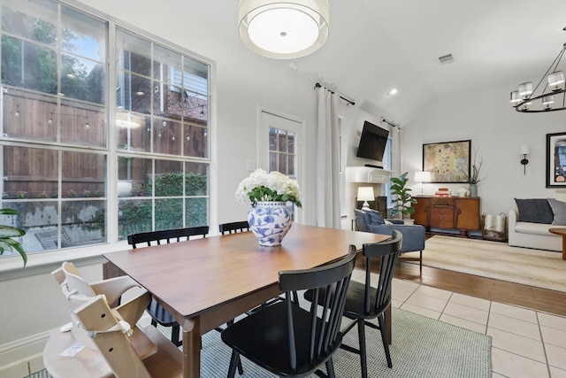 8926 White Pine Ln, Dallas, TX 75238 - dining room featuring tile patterned flooring, a chandelier, recessed lighting, lofted ceiling, and visible vents
