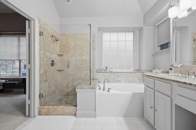 8926 White Pine Ln, Dallas, TX 75238 - bathroom featuring a bath, tile patterned flooring, vaulted ceiling, a stall shower, and vanity