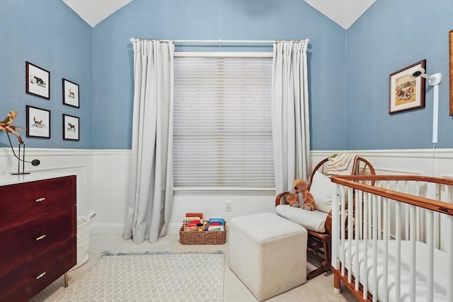 8926 White Pine Ln, Dallas, TX 75238 - carpeted bedroom with a nursery area, wainscoting, and lofted ceiling