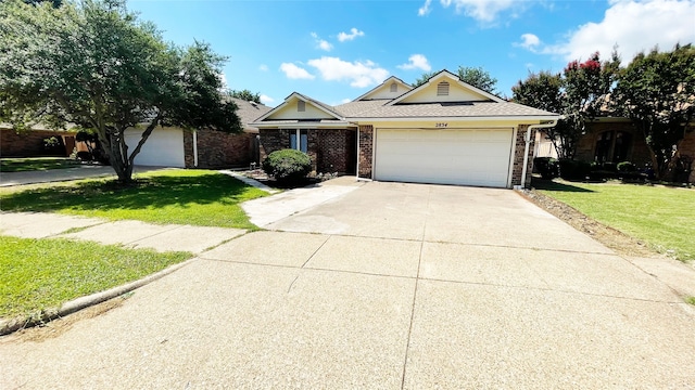 ranch-style house with a garage, driveway, a front lawn, and brick siding